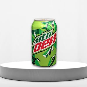 May include: A green and red can of Mountain Dew soda with a geometric pattern. The can is sitting on a white surface.