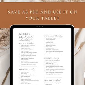 May include: A digital tablet displaying a weekly cleaning checklist with tasks organized by day and room. The checklist includes tasks like emptying trash cans, cleaning countertops, vacuuming floors, dusting surfaces, and changing bed sheets. The tablet is on a beige surface with a brown background.