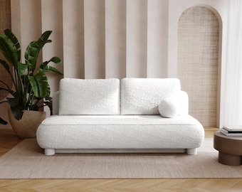 Vit Bouclé bäddsoffa – Minimalistisk Japandi-design med mjuka kurvor, bekväm bäddsoffa för moderna och mysiga interiörer