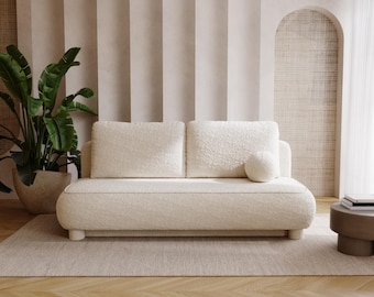 Stilvolles, modernes, cremefarbenes Boucle-Sofa mit geschwungenem Design - perfekt für das zeitgenössische Wohn- oder Schlafzimmerdekor / Boucle-Sofa / moderne Möbel