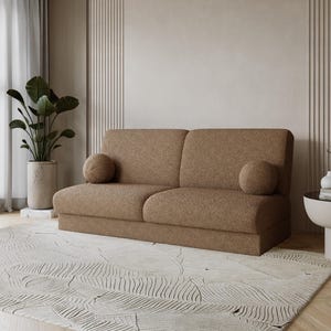Svängd mörkbeige bouclébäddsoffa – Japandi minimalistisk bäddsoffa, varm neutral ton, med förvaring