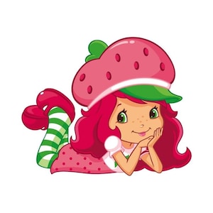 May include: A cartoon illustration of a girl with red hair and green eyes, wearing a strawberry-shaped hat and a pink dress with red polka dots. She is lying down, resting her chin on her hands, with green and white striped socks.