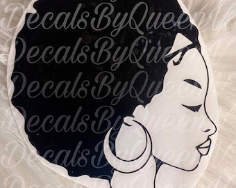 May include: Black and white silhouette of a woman with an afro hairstyle and large hoop earrings. The woman is facing to the right and has her eyes closed.