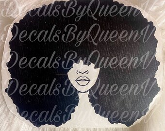 May include: Black and white silhouette of a woman with an afro hairstyle. The woman's face is visible, with a simple outline of her eyes, nose, and lips.