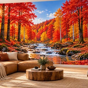 May include: A large wall mural depicting a vibrant autumn forest with red and orange trees, a flowing stream, and rocky banks. The scene is set behind a brown sectional sofa, a round wooden coffee table, and a wooden armchair on a rug.