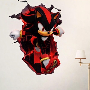 May include: A 3D wall decal featuring Shadow the Hedgehog bursting through a cracked wall. The character is black with red accents, wearing red shoes and gold rings. The background is a fiery red, creating a dynamic and action-packed scene.