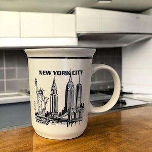 Ironton New York City The Big Apple USA Themed Souvenir Ceramic Coffee Mug Embossed With Skyline Buildings Statue Of Liberty & Facts