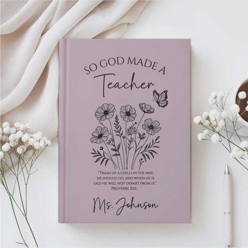 May include: A lavender journal with the text "SO GOD MADE A Teacher" and a floral design. The journal includes the quote "TRAIN UP A CHILD IN THE WAY HE SHOULD GO, AND WHEN HE IS OLD HE WILL NOT DEPART FROM IT." and the name "Ms. Johnson".