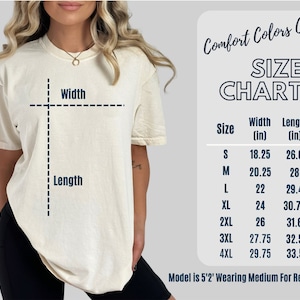 May include: Size chart for a t-shirt with measurements in inches. The chart shows the width and length of the shirt in sizes S, M, L, XL, 2XL, 3XL, and 4XL. The model is 5'2" and wearing a size Medium for reference.