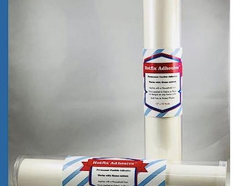 May include: Two rolls of white adhesive material in clear plastic tubes. Each roll has a label that reads "Hotfix Adhesive" with blue and red accents. The rolls are 12 inches by 12 yards.