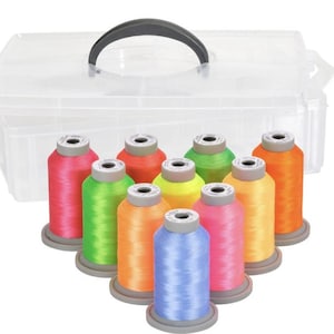 May include: A clear plastic storage box with a handle, containing 10 spools of neon colored thread. The spools are arranged in a semi-circle, with the colors ranging from pink to orange, yellow, green, and blue.