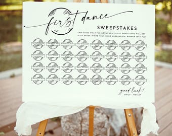 May include: A white sign on a wooden easel with the words "first dance" in elegant script. The sign includes a sweepstakes for guests to guess the first dance song. The sign is decorated with vinyl record graphics.