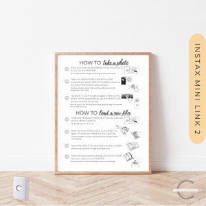 May include: A white instruction sheet with black text and illustrations showing how to take a photo and load new film into an Instax Mini Link 2 printer. The instructions include steps for turning the printer on and off, connecting to the smartphone app, taking a photo, editing the photo, printing the photo, and loading new film.