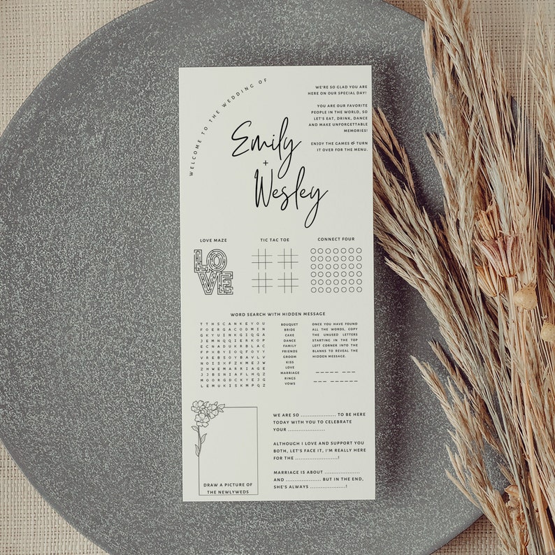 K&ouml;nnte beinhalten: Ein druckbares Hochzeitsempfangs-Aktivit&auml;tsblatt mit Spielen wie einem Liebeslabyrinth, Tic-Tac-Toe, Vier gewinnt und einer Wortsuche. Das Blatt ist beige mit schwarzem Text und Grafiken. Der Text oben lautet "Willkommen zur Hochzeit von Emily + Wesley".