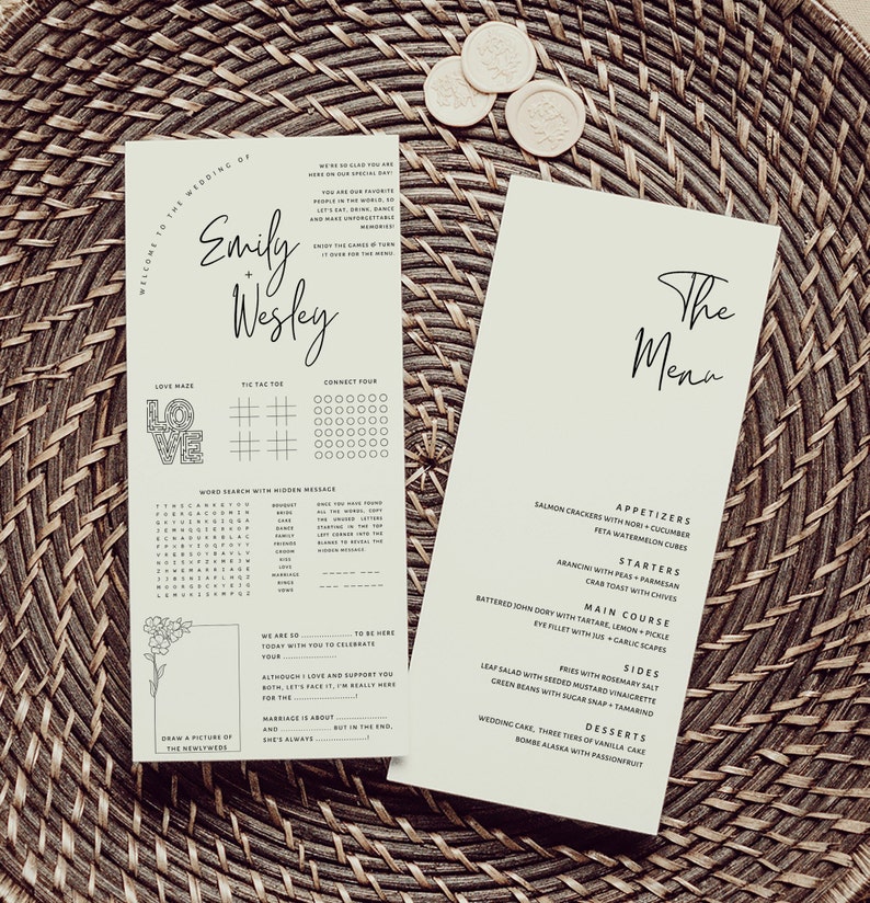 May include: A wedding menu with a handwritten font, featuring starters, main course, sides, and desserts. The menu includes dishes like salmon crackers with nori and cucumber, arancini with peas and parmesan, and battered John Dory with tartare, lemon, and pickle.