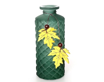 Frosted glass bottle vase with maple leaf decoration