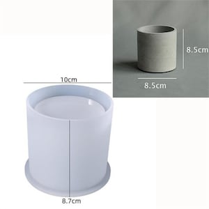 May include: White silicone mould for making concrete planters. The mould is 8.7 cm in diameter and 10 cm tall. The finished planter will be 8.5 cm in diameter and 8.5 cm tall.
