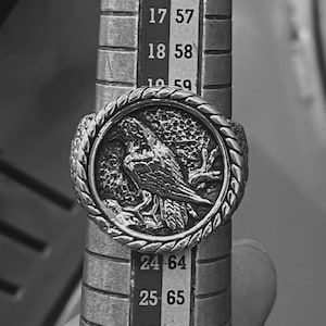 This Viking-inspired raven ring symbolizes foresight, battle wisdom, and spiritual connection, crafted from durable silver and featuring fine handcrafted detailing. Ideal for Norse mythology enthusiasts and men looking for meaningful statement rings.