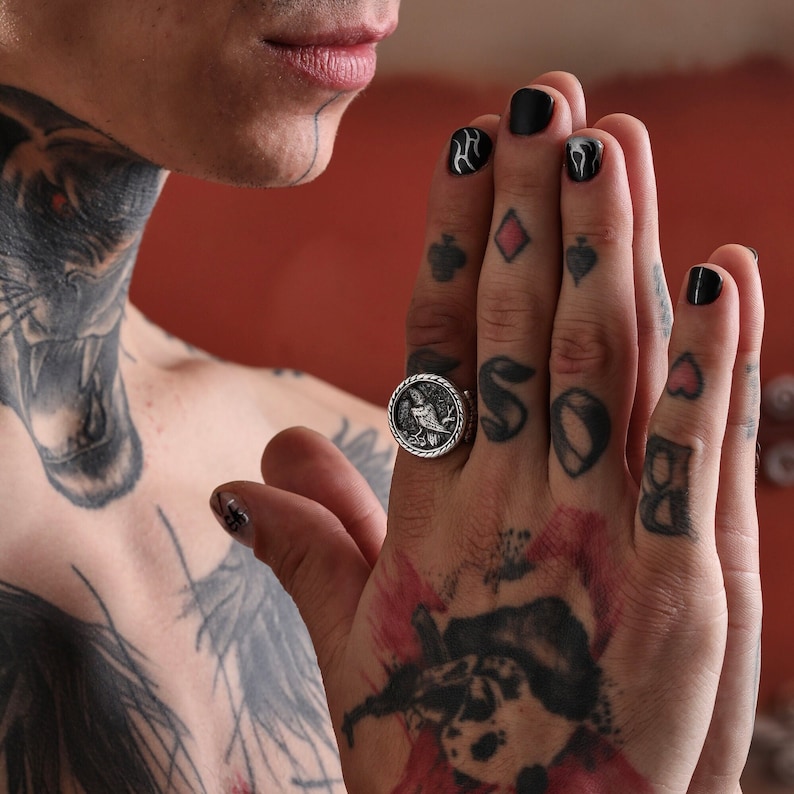 A bold silver raven ring handcrafted with Norse inspiration, featuring precise detailing and a smooth oxidized finish. This unisex ring merges Viking symbolism with modern craftsmanship, making it an exceptional gift for men who value ancient myths and timeless design.