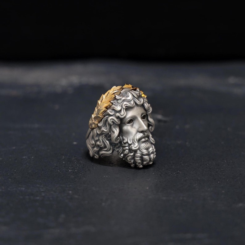 Elevate your style with this striking 14k gold-plated sterling silver Zeus ring, designed for men who appreciate bold and powerful statement jewelry. Handcrafted with intricate Greek mythology details, this unique ring is the perfect accessory to add sophistication and strength to any outfit. Ideal for those seeking a distinctive and luxurious Greek-inspired ring that exudes mythological charm and elegance.
