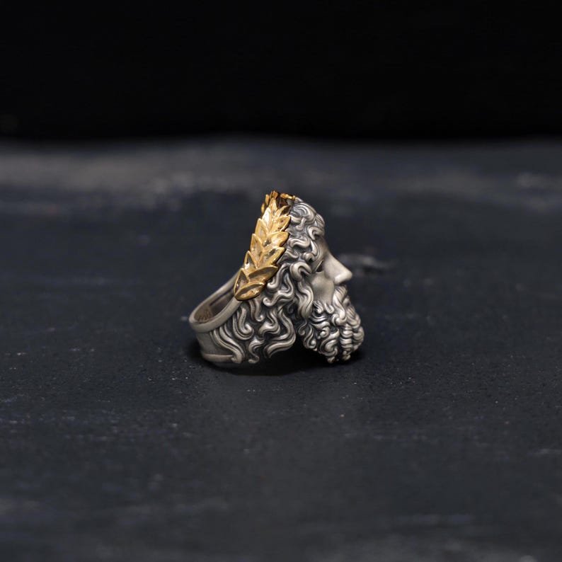 Styled on the hand, this Greek-inspired Zeus ring instantly elevates any outfit with a touch of mythological elegance and masculine sophistication. Perfect for daily wear or special occasions, this ring combines the power of ancient Greek gods with modern style, making it a versatile piece for the confident man.