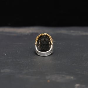 Detail shot highlighting the ring’s substantial 21.78-gram weight, 26.9mm diameter, and 2mm thickness. Crafted from sterling silver with 14k gold plating, this Greek Zeus ring for men is built for both elegance and durability, embodying the bold, masculine energy of Greek mythology jewelry.