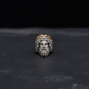 Side profile view of this handcrafted sterling silver Zeus ring, showcasing the meticulous details of the Greek-inspired design and the radiant 14k gold plating. A bold statement piece that captures the power of Zeus and the elegance of mythological jewelry, perfect for men who want to stand out and embrace their inner strength.