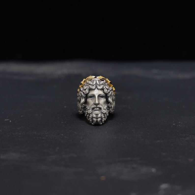 Side profile view of this handcrafted sterling silver Zeus ring, showcasing the meticulous details of the Greek-inspired design and the radiant 14k gold plating. A bold statement piece that captures the power of Zeus and the elegance of mythological jewelry, perfect for men who want to stand out and embrace their inner strength.