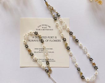 Pulsera con correa para teléfono con dije de estrella minimalista, pulseras de cadena para teléfono celular con flores blancas y negras con cuentas, correa para teléfono hecha a mano, regalo para ella