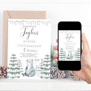 May include: A white invitation with blue and gray accents for a winter-themed first birthday party. The invitation features a cartoon polar bear sitting in a snowy forest with pine trees. The text on the invitation reads "Please join us at Taylor's Winter One-derland 1st Birthday! Saturday, December 3rd, 2PM The Clause Residence 123 Santa Dr. Apple, NY, 54321 RSVP to Jean 0123-456-7890".