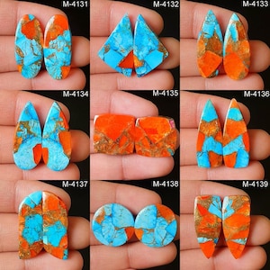 May include: A collection of nine pairs of gemstone cabochons in various shapes. The stones feature a striking combination of turquoise blue, vibrant orange, and brown matrix patterns. Each pair is unique, showcasing the natural beauty of the materials.