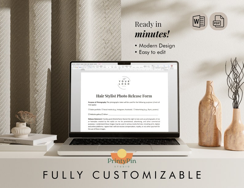 May include: A laptop computer displaying a hair stylist photo release form template on the screen. The form is titled "Hair Stylist Photo Release Form". The laptop is on a white surface with a book and two vases with dried flowers.