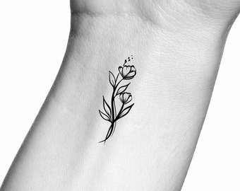May include: A simple black line drawing tattoo design of two flowers with stems and leaves.