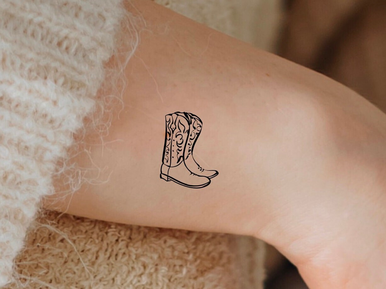 Small cowboy boot tattoo