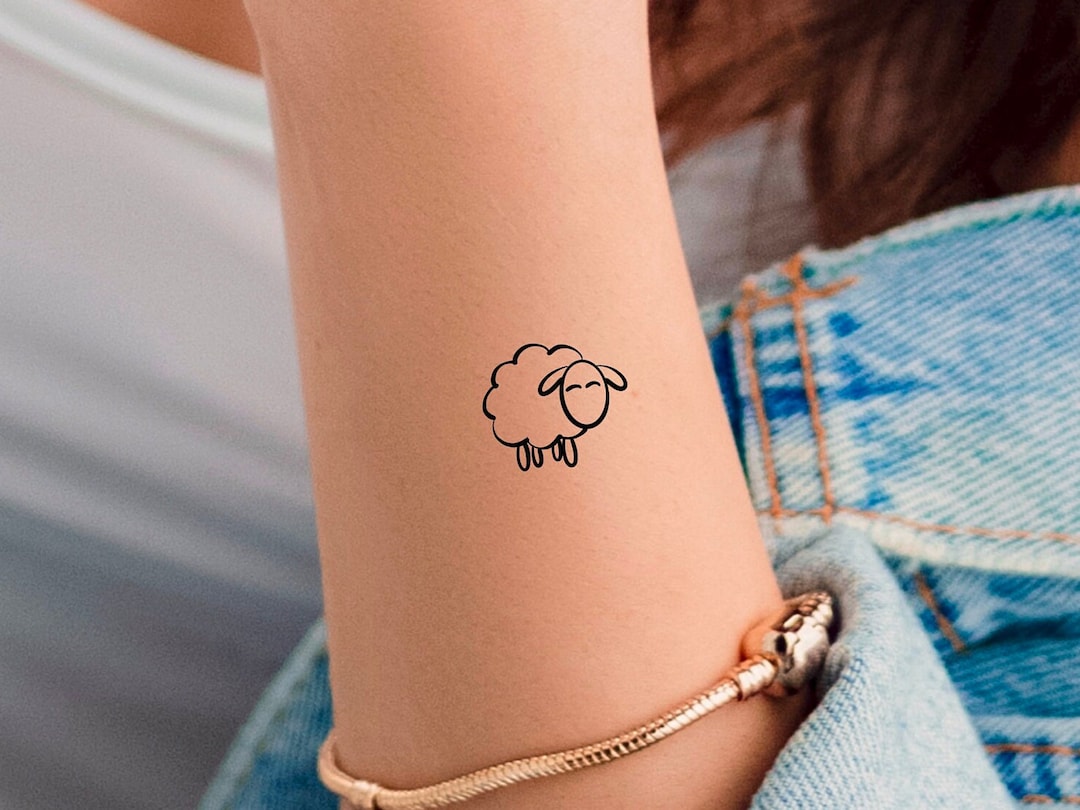 Awesome Black Outline Sheep Tattoo On Ankle