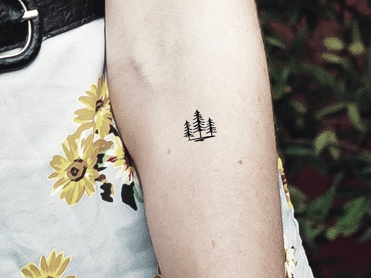 Small pine tree tattoo on the ring finger  Tattoogridnet