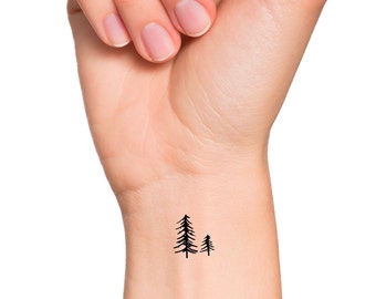 Minimalist tree tattoo on the right arm