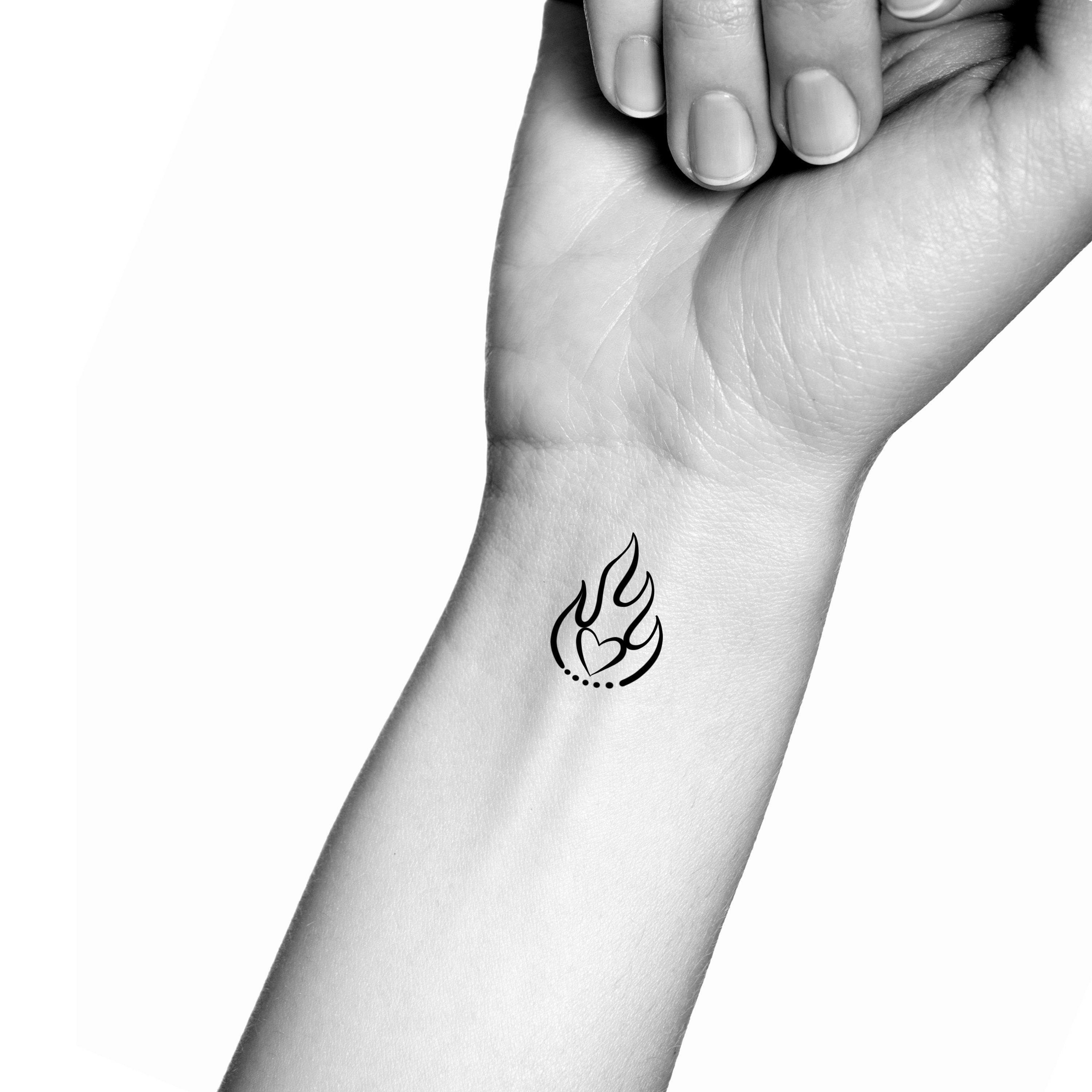 Small flame tattoo on wrist | Fire tattoo, Flame tattoos, Forearm tattoos