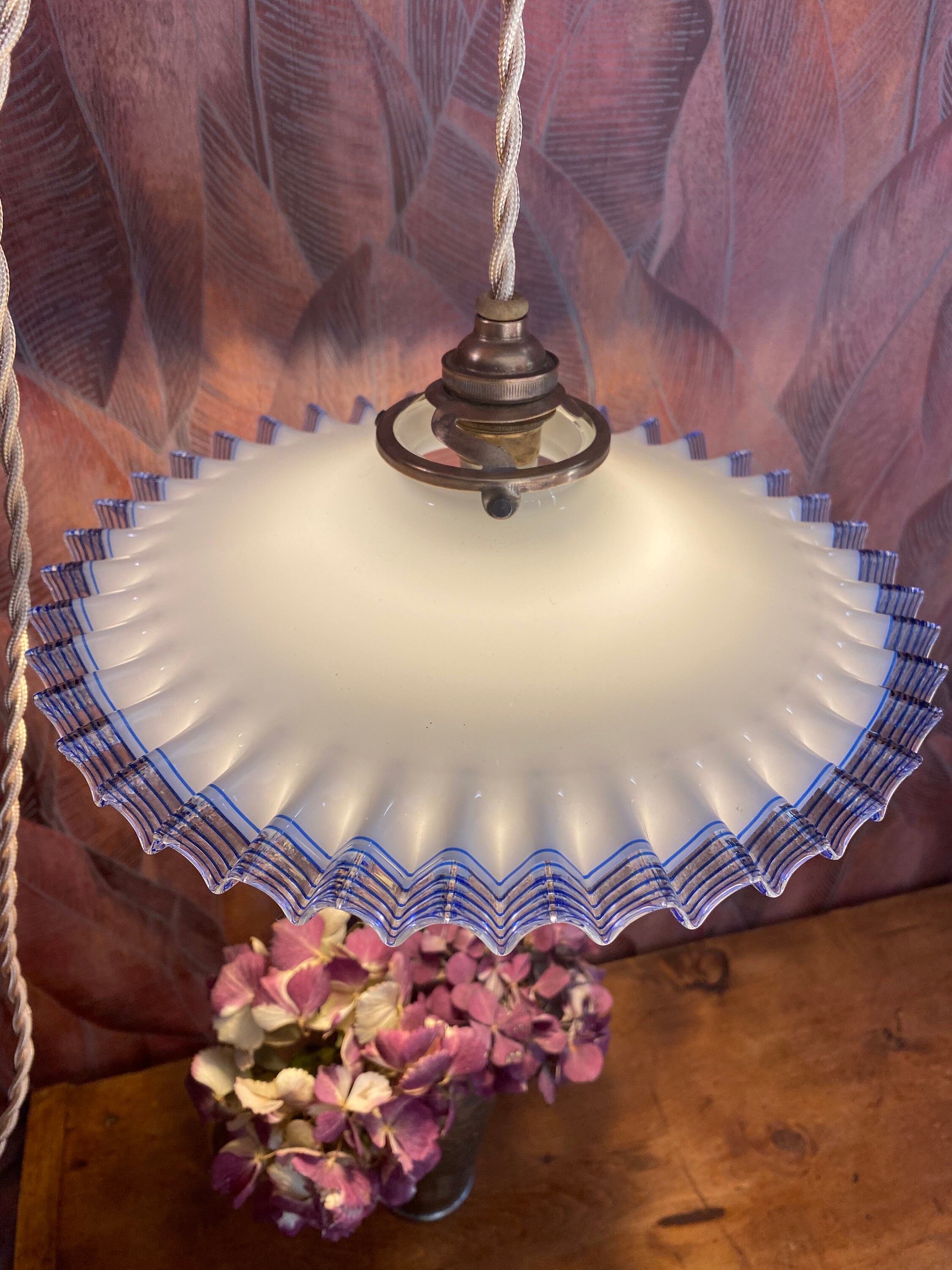 Vintage pendant light with white opaline lampshade in Art Deco style, old ruffled lampshade, retro chic.