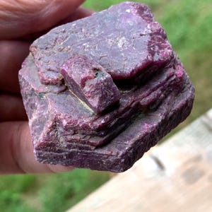 Three-quarter raw ruby crystal view, offset companion crystal and rugged surface, Indian mineral collection piece.