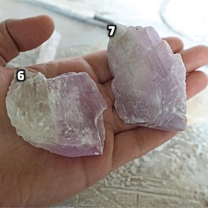 May include: Two pieces of purple and white selenite crystals, labeled 6 and 7.