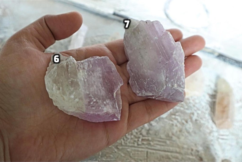 May include: Two pieces of purple and white selenite crystals, labeled 6 and 7.