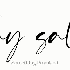 May include: A minimalist design featuring the phrase "stay salty" in elegant black script. Below the phrase, the text "Something Promised" is written in a smaller, lighter font. The background is a soft, off-white color.
