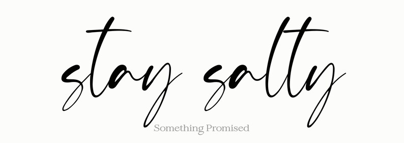 May include: A minimalist design featuring the phrase "stay salty" in elegant black script. Below the phrase, the text "Something Promised" is written in a smaller, lighter font. The background is a soft, off-white color.