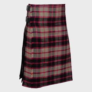 May include: A black, red and grey tartan kilt with a leather strap and buckle.