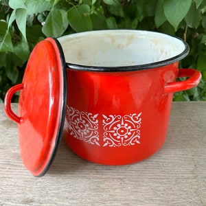 Vintage enamel red large pot with lid. White detailed pattern. 10 inches wide, 9 inches tall.