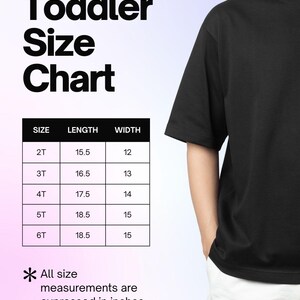 May include: A toddler size chart featuring a black t-shirt and a table with columns for size, length, and width in inches. The table lists sizes 2T through 6T with corresponding measurements. Text reads Toddler Size Chart and All size measurements are expressed in inches.