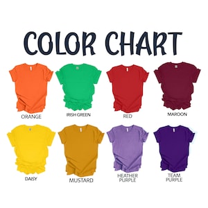 May include: A color chart featuring eight short-sleeve t-shirts in various colors labeled orange, irish green, red, maroon, daisy, mustard, heather purple, and team purple. The text COLOR CHART is displayed in large dark blue letters at the top.