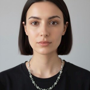The alternating pierced and smooth stainless steel rings for an alt-fashion look.