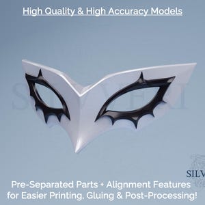 May include: A white and black mask with a pointed design. The mask has a central point and black accents around the eye openings. Text at the top reads "High Quality & High Accuracy Models". Text at the bottom reads "Pre-Separated Parts + Alignment Features for Easier Printing, Gluing & Post-Processing!"